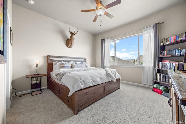 bedroom featuring carpet floors, baseboards, and a ceiling fan