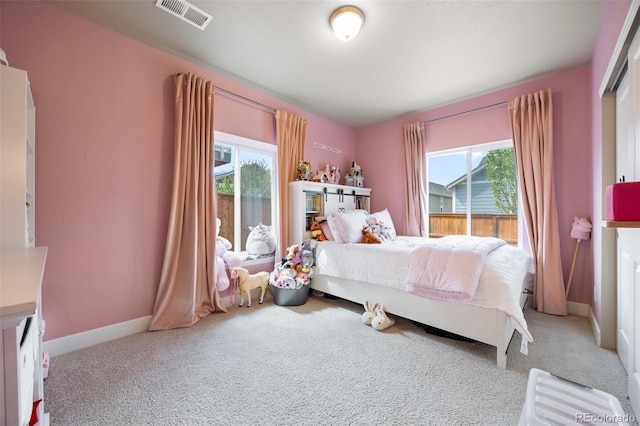 bedroom featuring carpet and baseboards