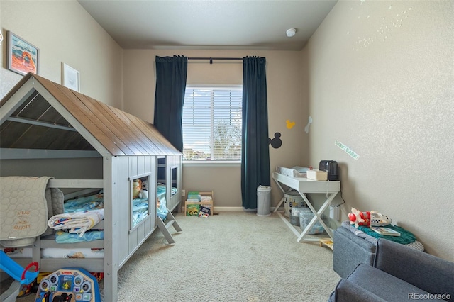 carpeted bedroom with baseboards