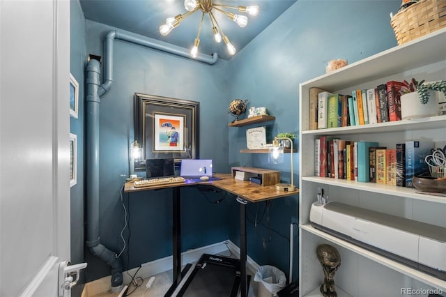 office area with a chandelier
