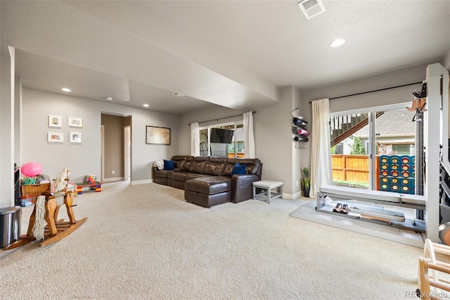living area with carpet floors, baseboards, and recessed lighting