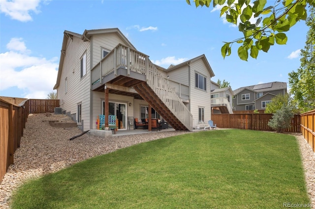 rear view of property with a deck, stairway, and a patio area