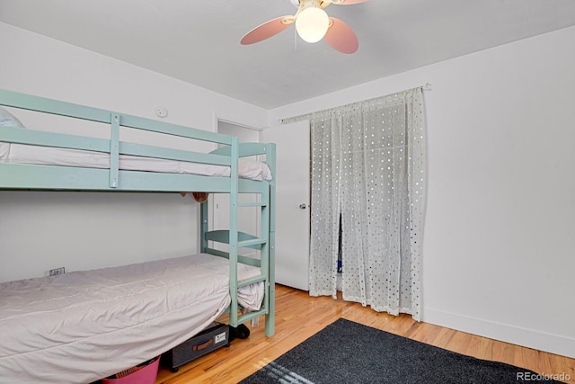 bedroom featuring a ceiling fan and wood finished floors