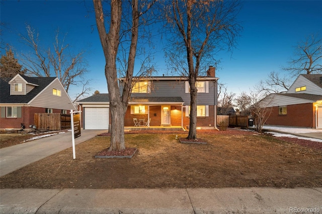 view of front of property featuring a garage and a porch