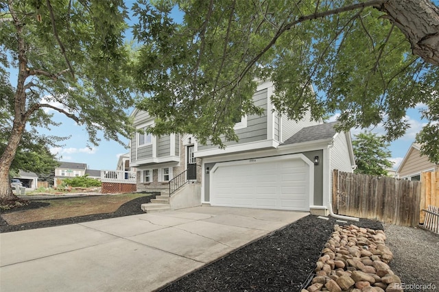 19954 E Dartmouth Ave, Aurora, CO 80013 - view of front of home with concrete driveway and an attached garage