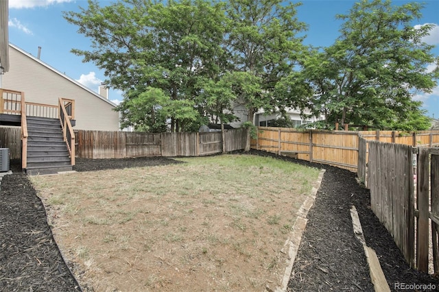19954 E Dartmouth Ave, Aurora, CO 80013 - fenced backyard featuring stairs and a wooden deck
