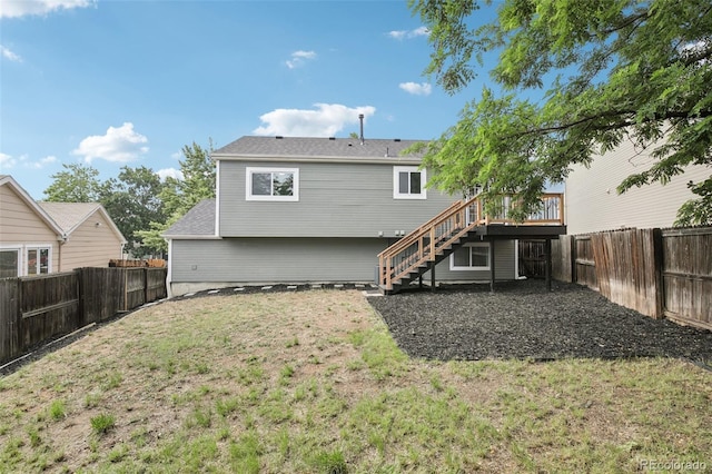 19954 E Dartmouth Ave, Aurora, CO 80013 - rear view of property featuring stairway, a fenced backyard, and a deck