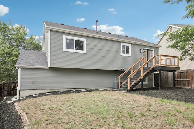 19954 E Dartmouth Ave, Aurora, CO 80013 - rear view of house featuring stairs, a fenced backyard, and a deck