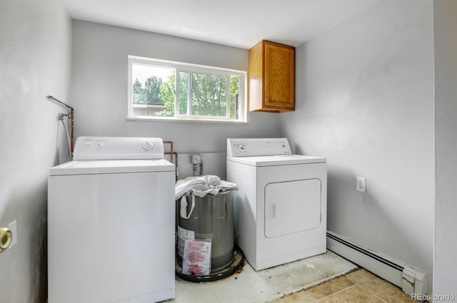 10491 W 7th Pl, Lakewood, CO 80215 - washroom with a baseboard radiator, washer and clothes dryer, and cabinet space