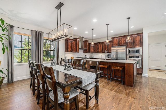 3357 N Akron Ct, Denver, CO 80238 - dining room featuring wood finished floors and recessed lighting