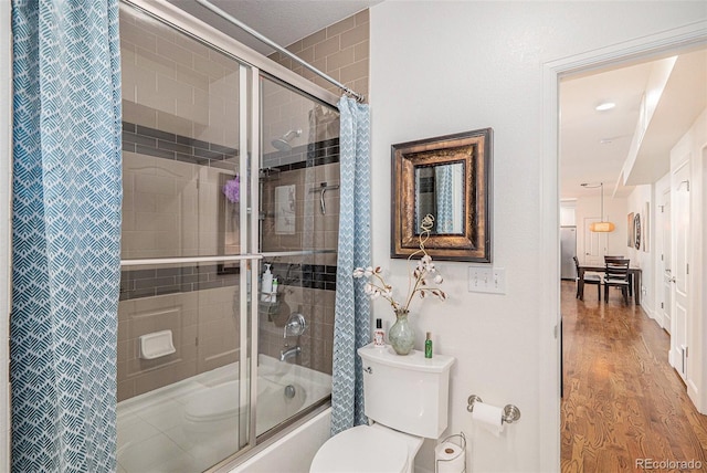 3357 N Akron Ct, Denver, CO 80238 - full bath with combined bath / shower with glass door and wood finished floors