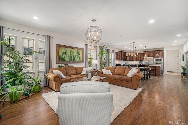 3357 N Akron Ct, Denver, CO 80238 - living room with a chandelier, recessed lighting, and dark wood-style floors