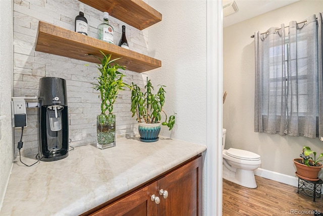 3357 N Akron Ct, Denver, CO 80238 - bathroom with wood finished floors and vanity