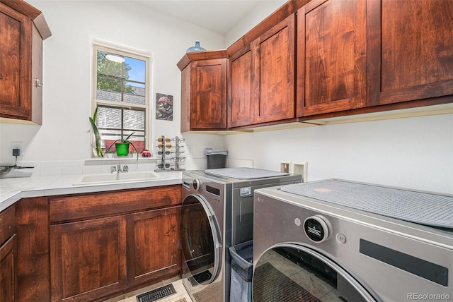3357 N Akron Ct, Denver, CO 80238 - laundry room featuring cabinet space and washing machine and dryer