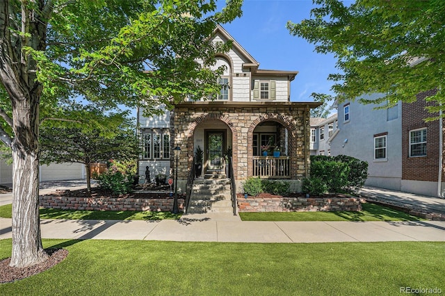 3357 N Akron Ct, Denver, CO 80238 - view of front of house with a front yard, covered porch, and stone siding