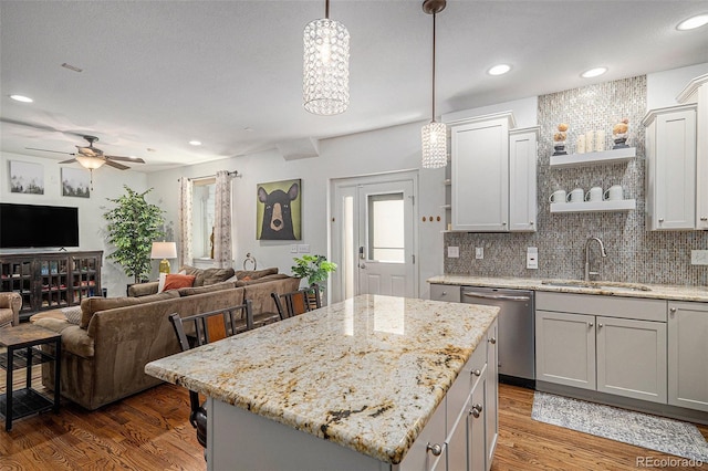 3357 N Akron Ct, Denver, CO 80238 - kitchen with stainless steel dishwasher, open shelves, ceiling fan, wood finished floors, and recessed lighting