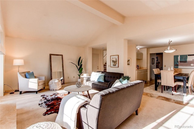 1530 S Quebec Way Unit 29, Denver, CO 80231 - living area featuring stairs, lofted ceiling with beams, and light colored carpet