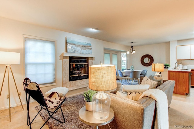 1530 S Quebec Way Unit 29, Denver, CO 80231 - living room with a high end fireplace and a notable chandelier