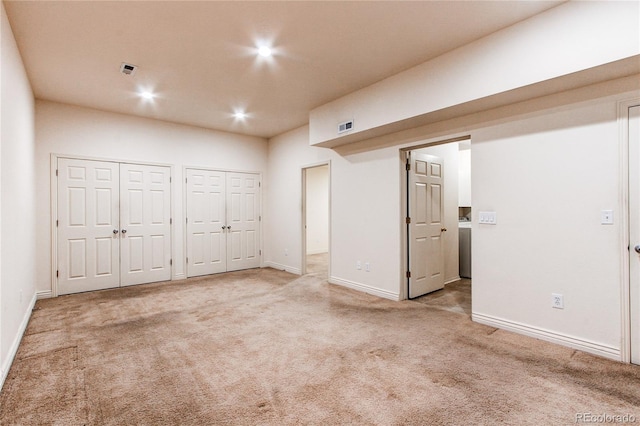 1530 S Quebec Way Unit 29, Denver, CO 80231 - spare room with baseboards, recessed lighting, visible vents, and carpet