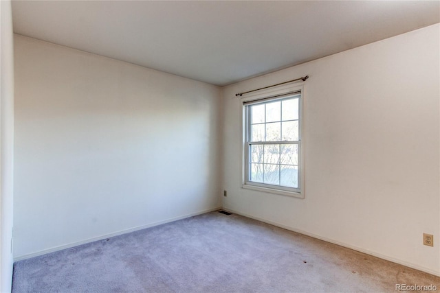 1530 S Quebec Way Unit 29, Denver, CO 80231 - empty room with light carpet, baseboards, and visible vents