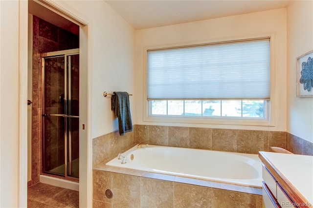 1530 S Quebec Way Unit 29, Denver, CO 80231 - bathroom featuring a stall shower, vanity, and plenty of natural light
