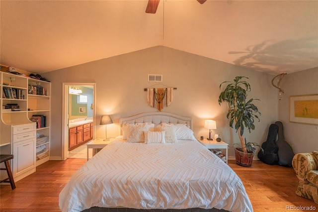 919 Taylor Ln, Erie, CO 80516 - bedroom featuring light wood-type flooring, lofted ceiling, a ceiling fan, and ensuite bathroom