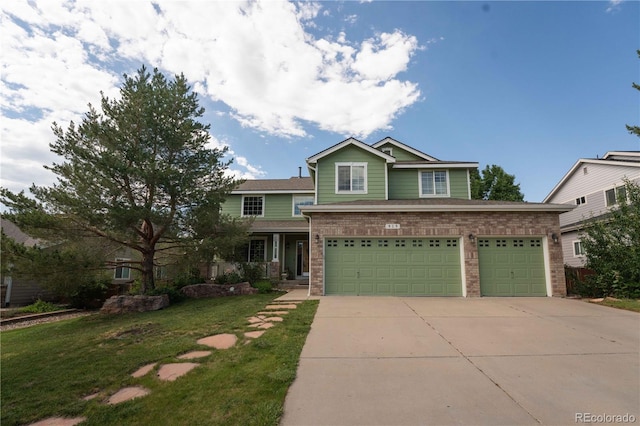 919 Taylor Ln, Erie, CO 80516 - view of front of home with driveway, a front yard, brick siding, and a garage