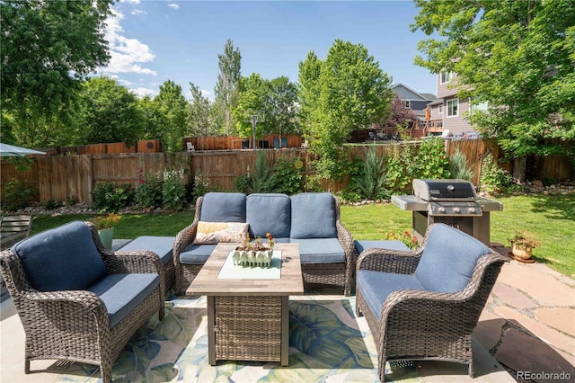 919 Taylor Ln, Erie, CO 80516 - fenced backyard with an outdoor hangout area, a grill, and a patio
