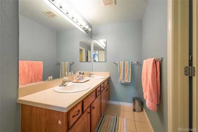 919 Taylor Ln, Erie, CO 80516 - bathroom with double vanity and tile patterned flooring
