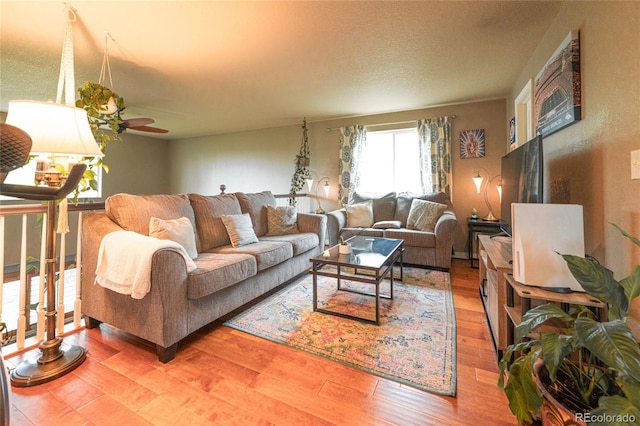 919 Taylor Ln, Erie, CO 80516 - living area featuring wood finished floors and a ceiling fan