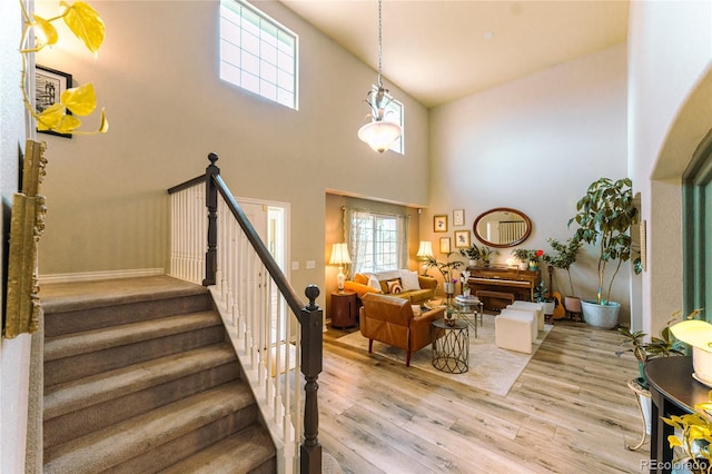 919 Taylor Ln, Erie, CO 80516 - staircase with wood finished floors and a high ceiling