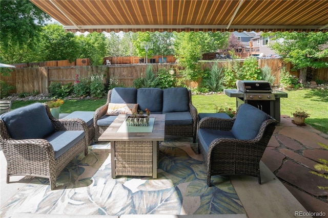 919 Taylor Ln, Erie, CO 80516 - fenced backyard with an outdoor living space, a patio, and area for grilling