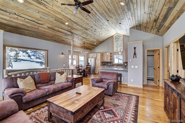 living room featuring light hardwood / wood-style flooring, high vaulted ceiling, ceiling fan with notable chandelier, a baseboard radiator, and wooden ceiling