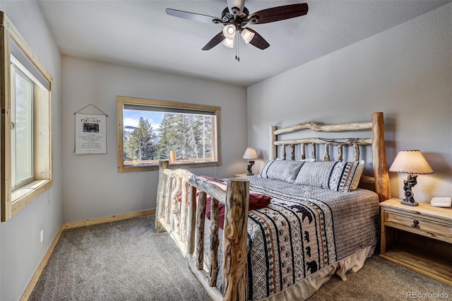 bedroom with ceiling fan and carpet floors