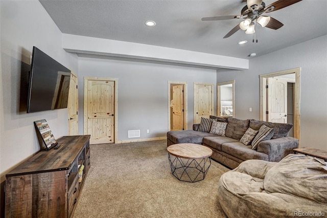 living room with carpet floors and ceiling fan