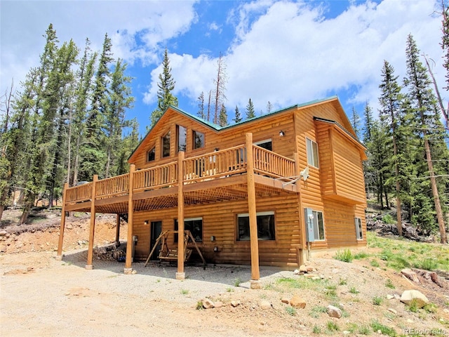 207 Pine Cone Way, Fairplay, CO 80440 - rear view of house featuring faux log siding and a wooden deck