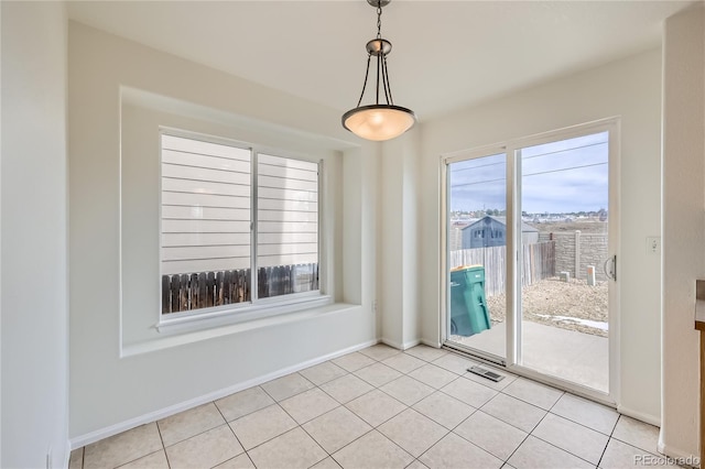 unfurnished room featuring light tile patterned flooring