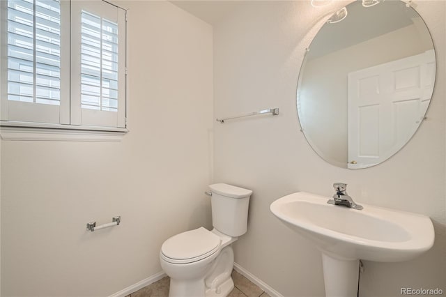 bathroom featuring tile patterned floors and toilet