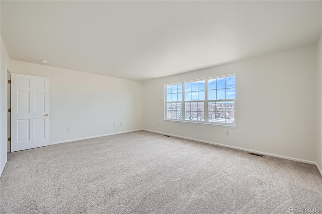 unfurnished room with carpet flooring