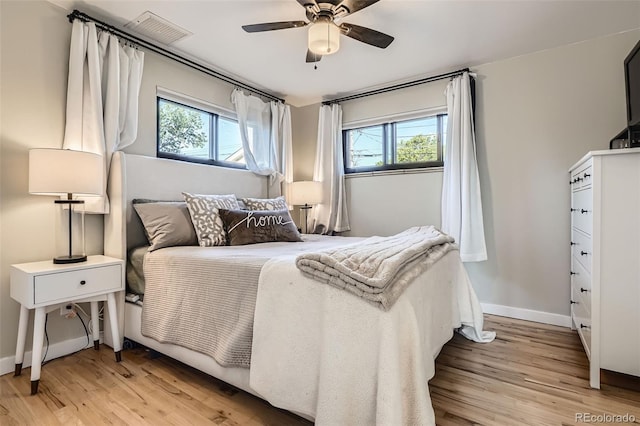 3224 Troy St, Aurora, CO 80011 - bedroom with light wood-style flooring, baseboards, and ceiling fan