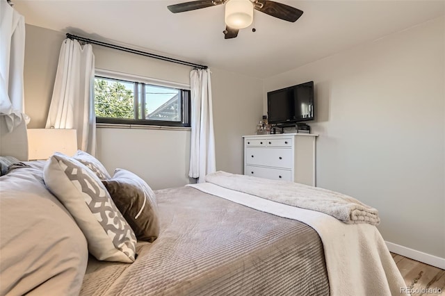 3224 Troy St, Aurora, CO 80011 - bedroom featuring light wood-style flooring, ceiling fan, and baseboards