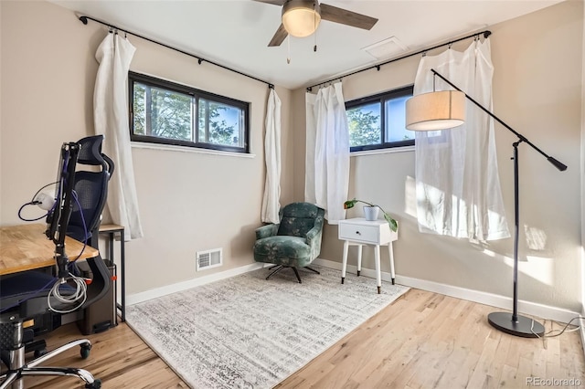 3224 Troy St, Aurora, CO 80011 - office space with wood finished floors, ceiling fan, and baseboards