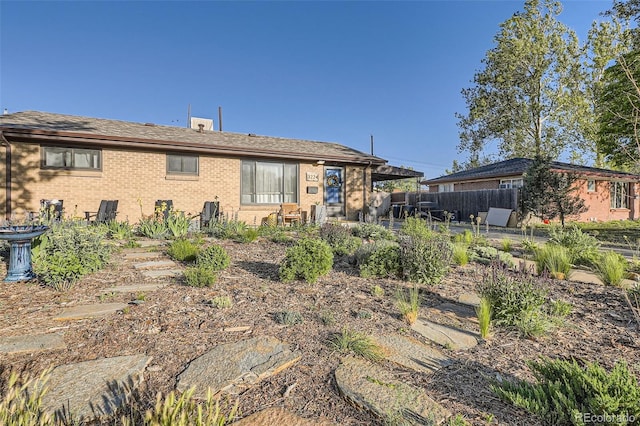 3224 Troy St, Aurora, CO 80011 - back of property featuring brick siding and a patio
