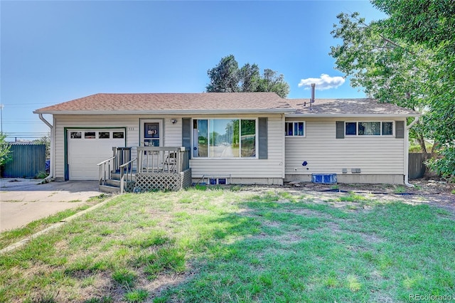 ranch-style home with a front lawn and a garage