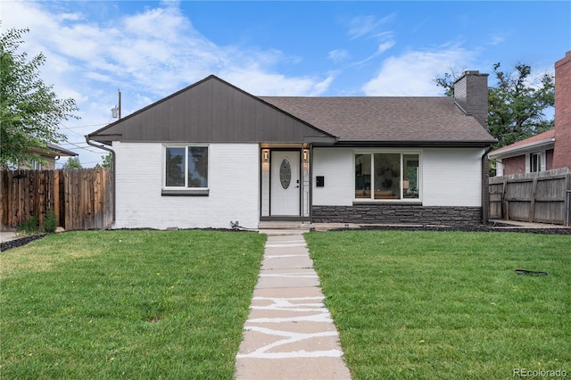 ranch-style house with a front lawn