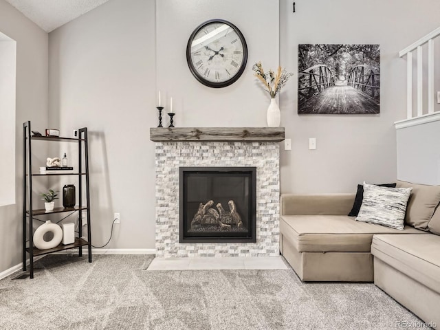 carpeted living room featuring a textured ceiling