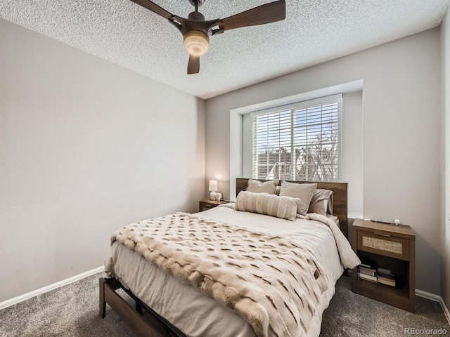 bedroom with dark colored carpet, a textured ceiling, and ceiling fan