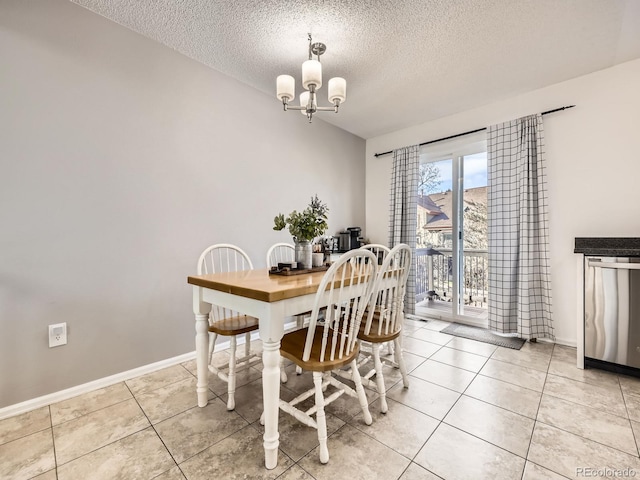 dining space featuring light tile patterned floors, a textured ceiling, and an inviting chandelier