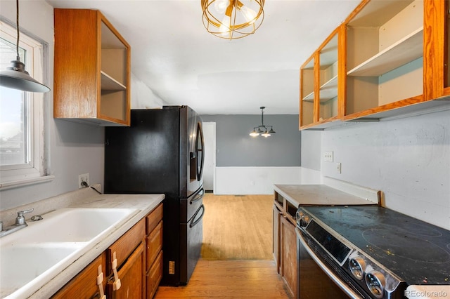 3341 W 94th Ave, Westminster, CO 80031 - kitchen featuring electric range oven, open shelves, light wood-style floors, and freestanding refrigerator