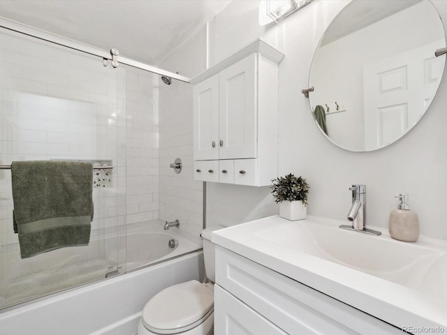 bathroom with shower / bath combination with glass door, vanity, and toilet